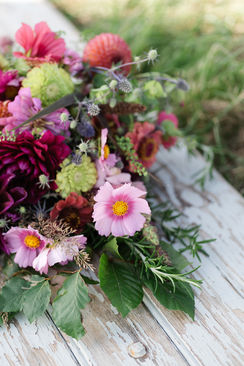 Bright Pink and Lime green flowers in a sheaf for tribute flowers at a funeral.  Hand-tied and perfect to lay on a grave or coffin. These are completely compostable and can be used at any green or natural burial ground.