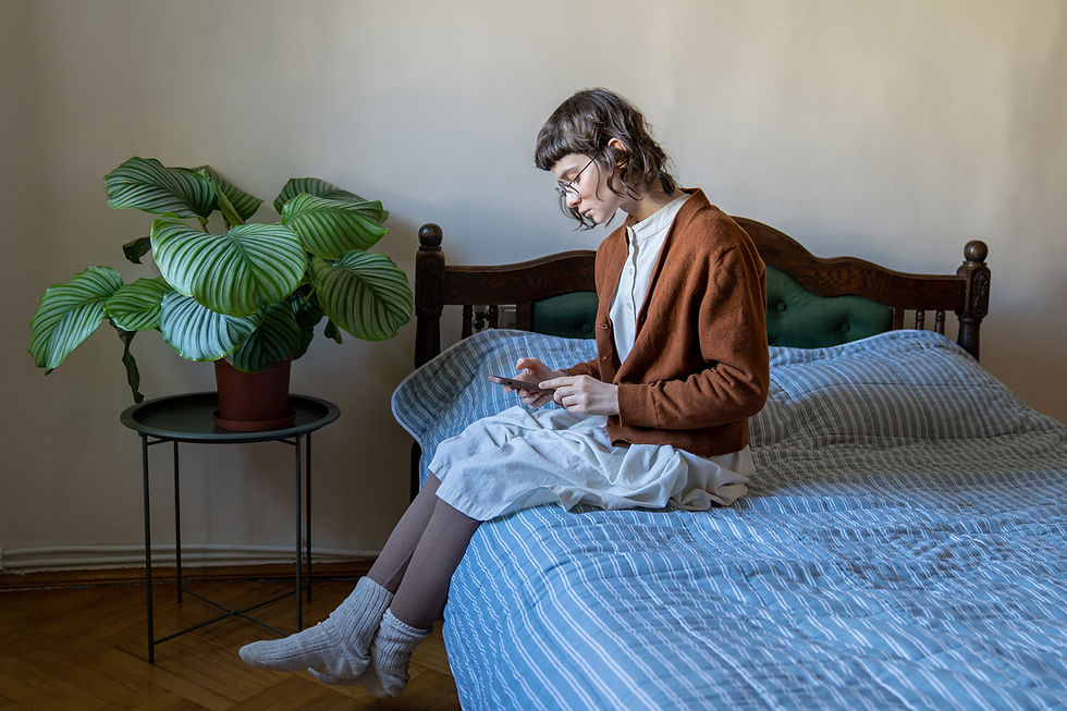 Long Cvid Fatigue - Woman Sitting on Bed With PHone