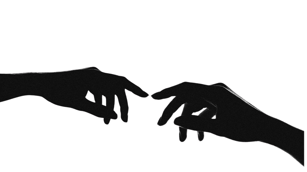Silhouetted hands reaching, symbolizing connection