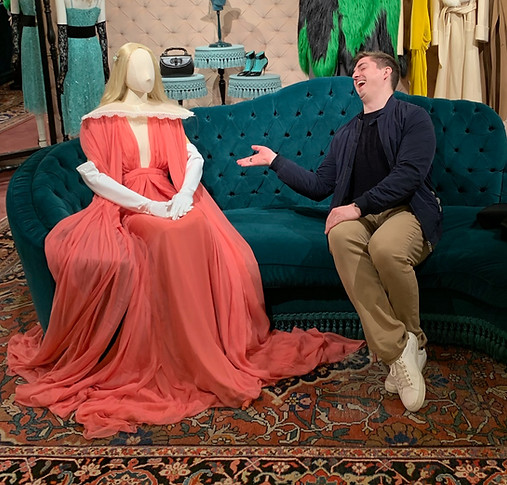A picture of me in the Gucci store on 5th Avenue in New York City. I am pretending to have a conversation with a mannequin.