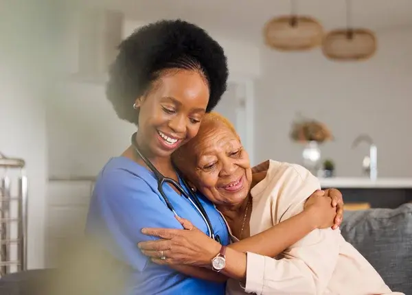 depositphotos_685267872-stock-photo-black-people-hug-nurse-elderly.jpg