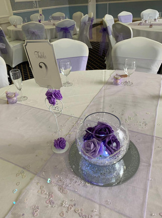 purple goldfish bowl and mirror plate centerpiece