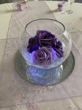 wedding goldfish bowl and mirror plate with purple flowers