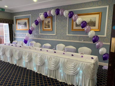 wedding top table twinkle skirt and swag with balloon arch