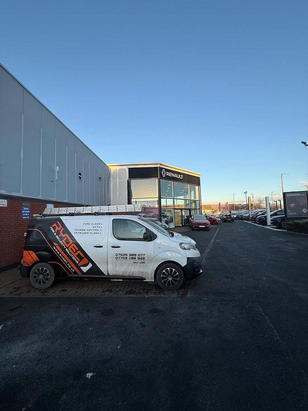 RYDEC Fire & Security Solutions van at commercial warehouse