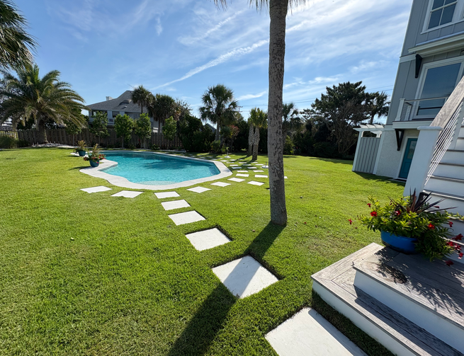 Lawn care and landscaping in Isle of Palms, South Carolina. Edging around pavers and swimming pool. Trimming, mowing, blowing, edging, and lawn maintenance. Top rated landscapers in the Lowcountry. Daniel Island, Isle of Palms, Sullivans Island, Mount Pleasant. Plantings, Sod Install, Cleanup