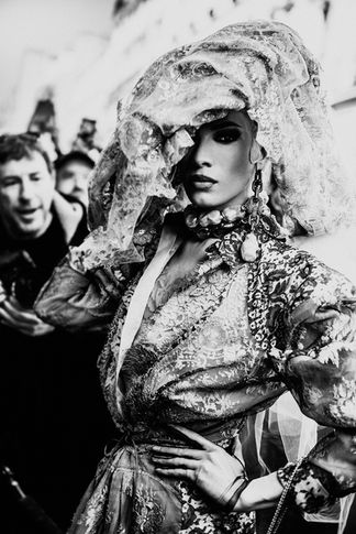 Miss Fame posing fiercely during Paris Fashion Week wearing Vivienne Westwood.

