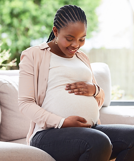 be-mother-cropped-shot-attractive-young-mother-be-sitting-sofa-home (1).png