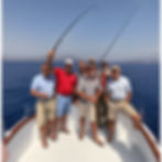 Real picture quality image of tour participants fishing on a large tour boat in the Aegean Sea.jpg