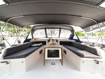 Dufour 470 cockpit with spacious seating and folding dining table, comfortable and functional.
