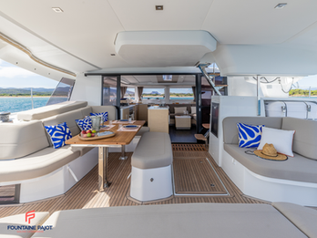 Fountaine Pajot FP44 exterior saloon with generous seating area, shaded and spacious.