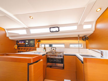 Jeanneau Sun Odyssey 440 galley with oven, stove, and generous storage cabinets.