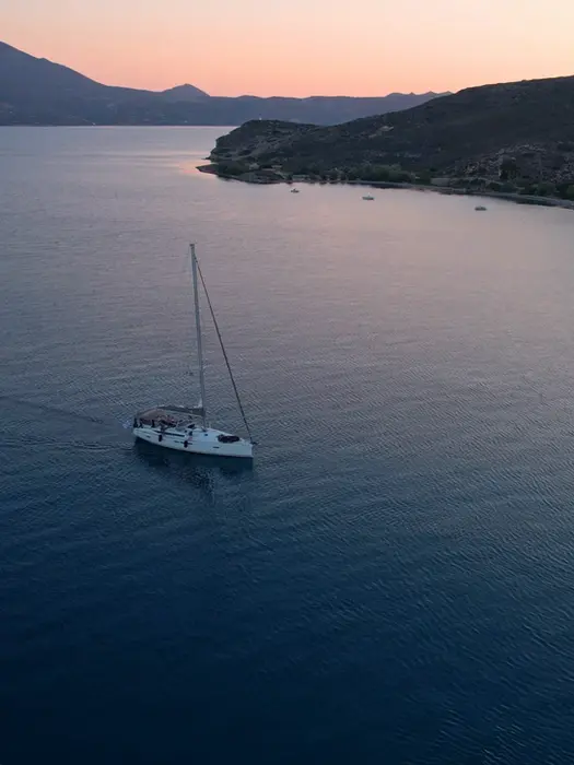 Aerial view of monohull approaching port, returning from Salty Fundamentals training day.