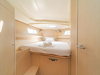 Beneteau Oceanis 41.1 double cabin with cream finish, comfortable berth and storage.