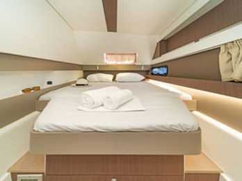 Bali 4.1 double cabin with a comfortable large bed and soft lighting.