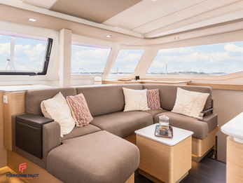 Fountaine Pajot FP41 interior saloon with comfortable seating around a coffee table, bright and airy.