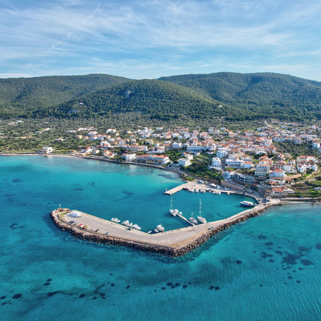 Aerial shot of Agia Marina harbour, Aegina, small fishing boats and a sheltered quay, perfect for anchoring and med mooring drills on Docking Drills sailing course.
