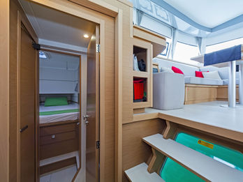 Excess 12 interior view from port hull showing a cabin and part of the saloon, efficient layout.