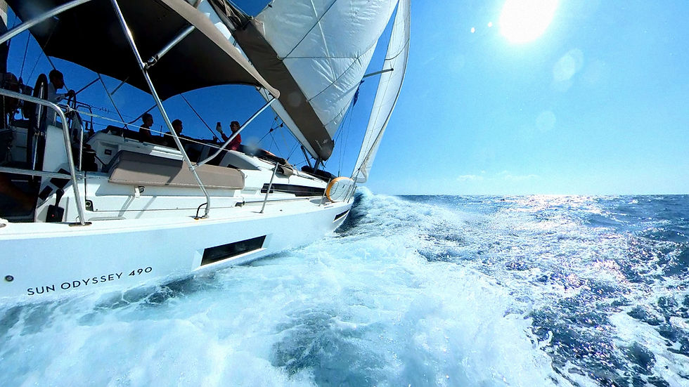 Monohull heeling on port tack under full sails, fast sailing on Aegean Sea, part of Salty Fundamentals beginner training in Greece.
