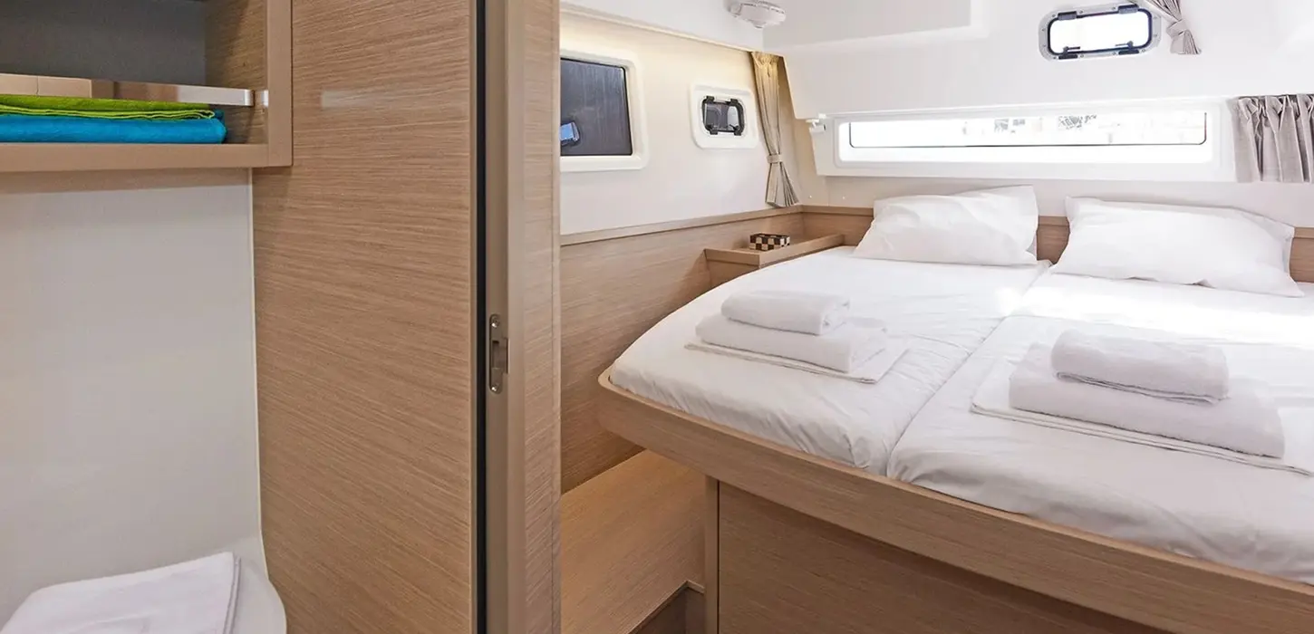 Spacious double cabin on Lagoon 42 with ensuite access, Catamaran Confidence accommodation.