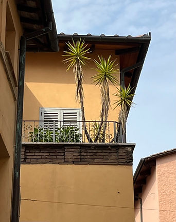 Italian house with balcony bathing in sunshine