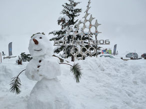 A snowman in from of a Torino 2006 sign, Sestriere, Italy