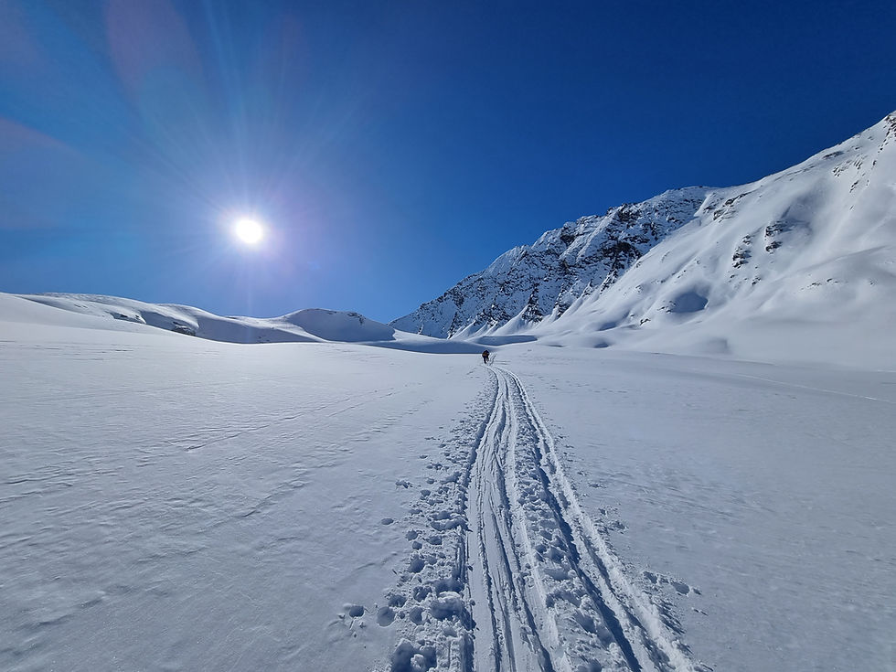 A skin track disappearing into a perfect blue sky
