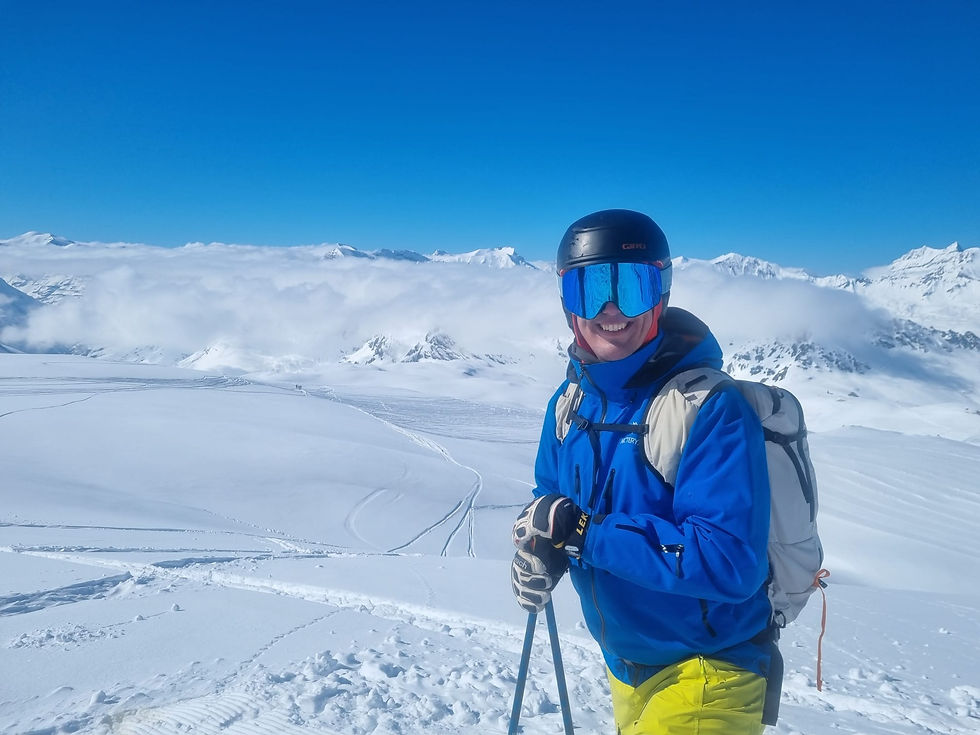 A skier smiling back to the camera in Val d'Isere, France