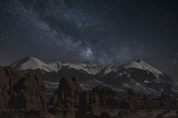 night redrock snowy mountains