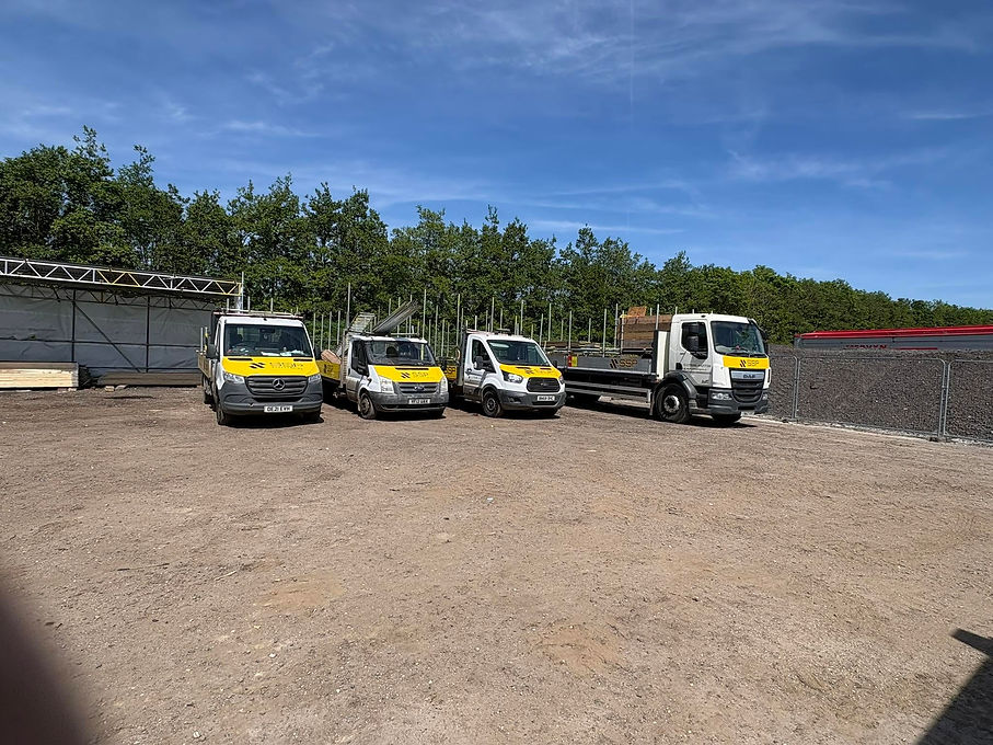 Four commercial SSP company vehicles, including vans and flatbed trucks
