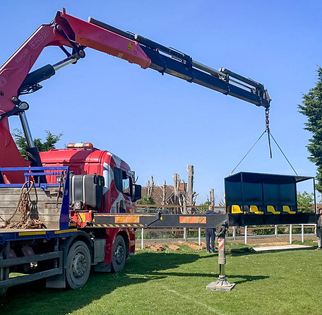 Hiab crane dropping off materials