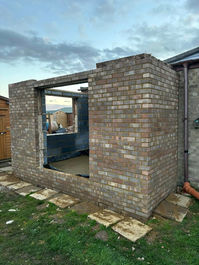 Brick walls under construction for a new home extension project