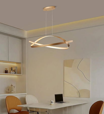 A modern dining space with a sleek hanging light fixture above a white table