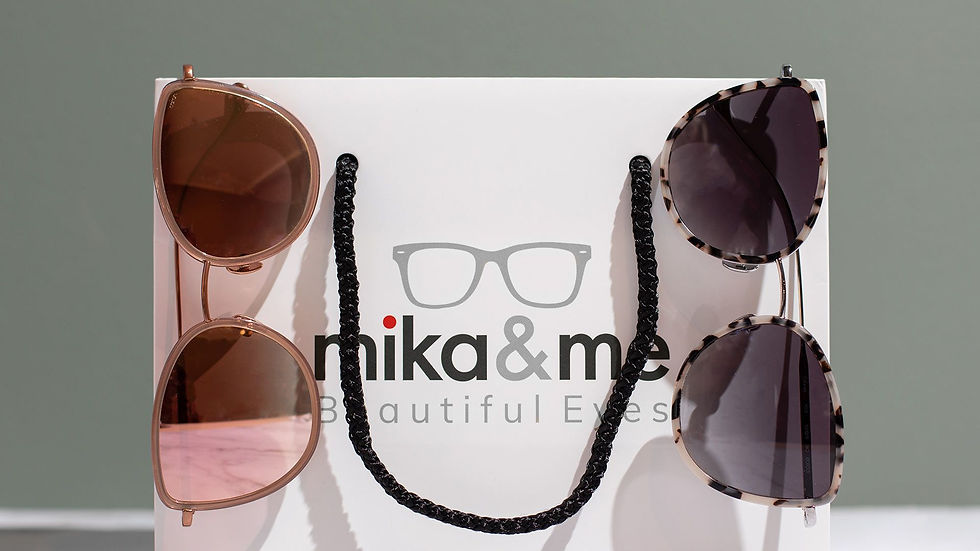 A white shopping bag with the logo "mika & me, Beautiful Eyes"