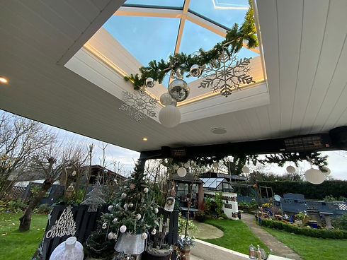 Sunroom conservatory extension with glass skylight and garden view
