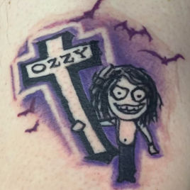 Tattoo featuring a cartoonish figure