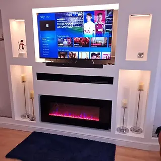 Modern living room setup features a wall-mounted TV displaying a sports channel