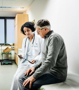 An elderly man talking to his doctor about some recent test results