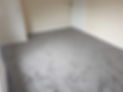 A close up view of a beige carpet floor
