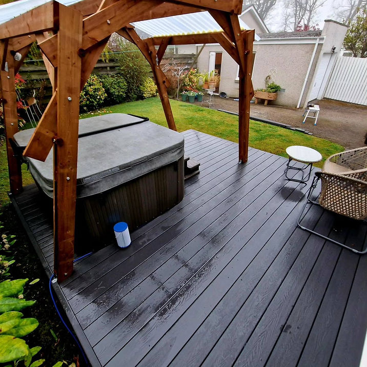 Outdoor wooden decking with covered hot tub, wooden pergola shelter