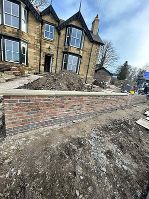 Victorian-style house with large windows, undergoing renovation