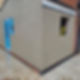 A corner of a newly plastered building with smooth beige walls