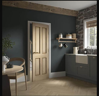 Cozy kitchen with dark walls and rustic stone accents