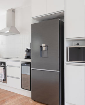 Modern kitchen with a sleek, stainless steel refrigerator