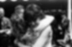film photograph in black and white of family members embracing at emotional heartfelt graduation event