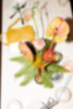 editorial documentary style film photography of birthday party luxury event florals and guest's purse on the table. luxury event accessories in an editorial bright colorful style on a yacht in chelsea piers, NYC