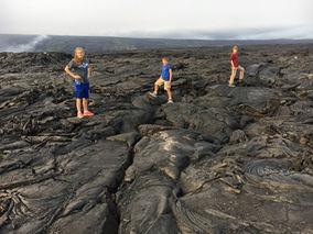 kids on lava field