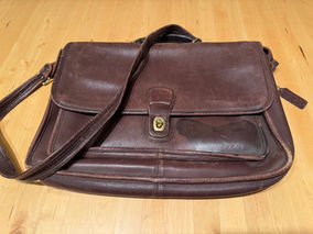 Leather brown bag with stain