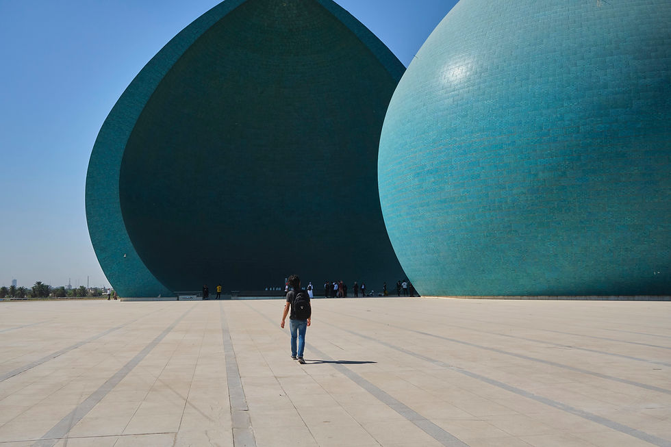 The Iraqi Way guide walks towards Al-Shaheed Monument in Baghdad, Iraq.