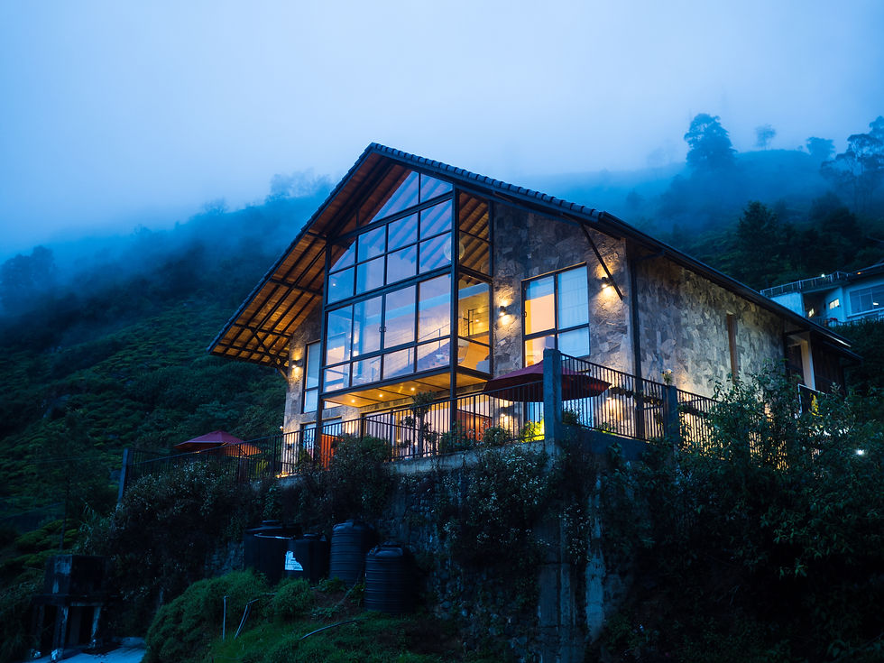A nice house on a foggy night over the tea fields in Nuwara Eliya, Sri Lanka